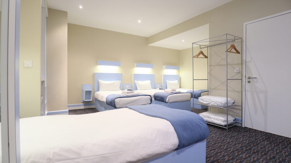 Quad Room with multiple beds for family stays